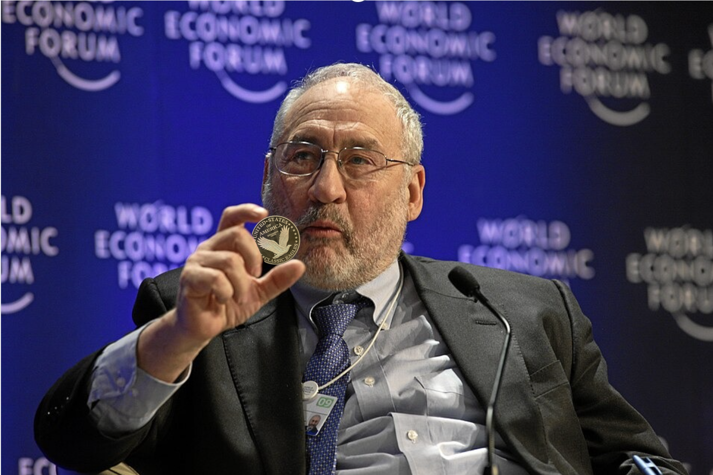 Dr. Reed holding the Eagle Coin